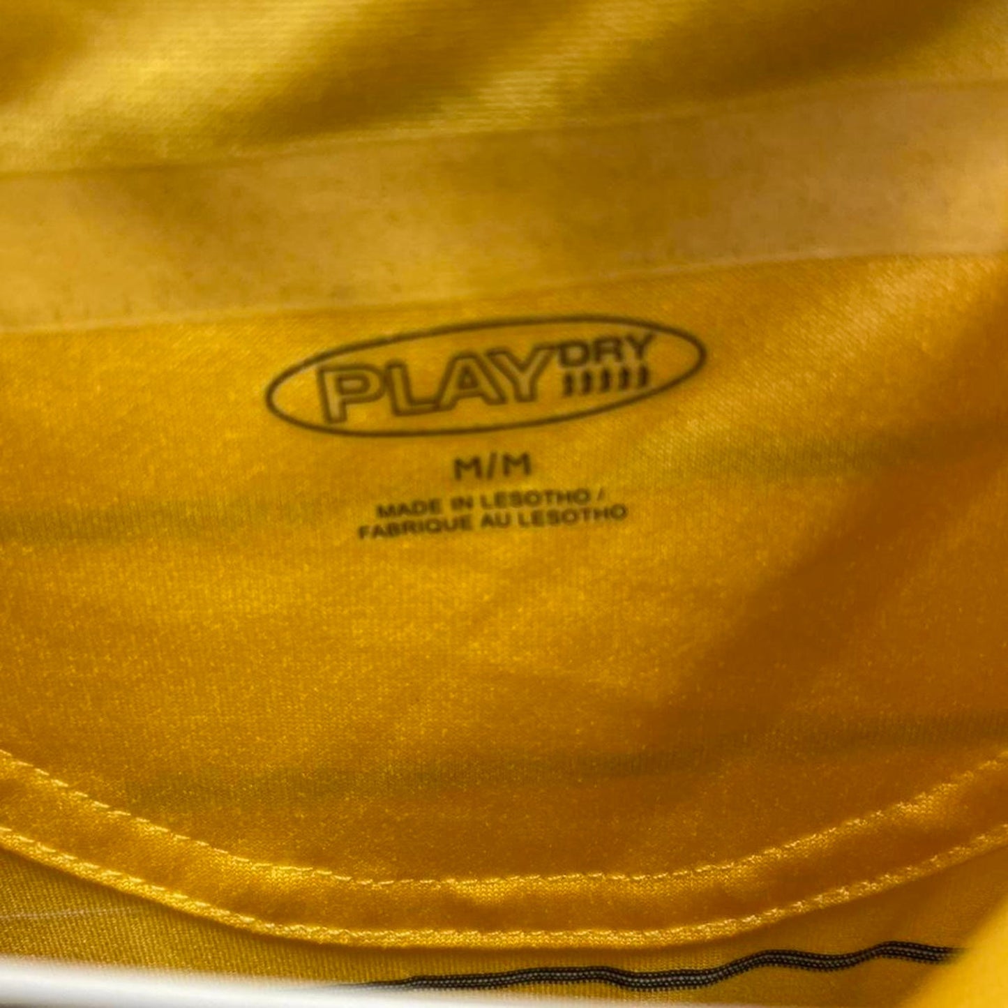 Yellow striped polo shirt