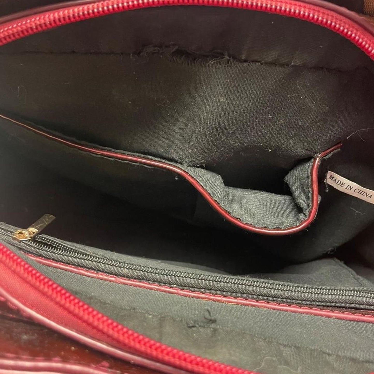 Burgundy patent leather bow handbag