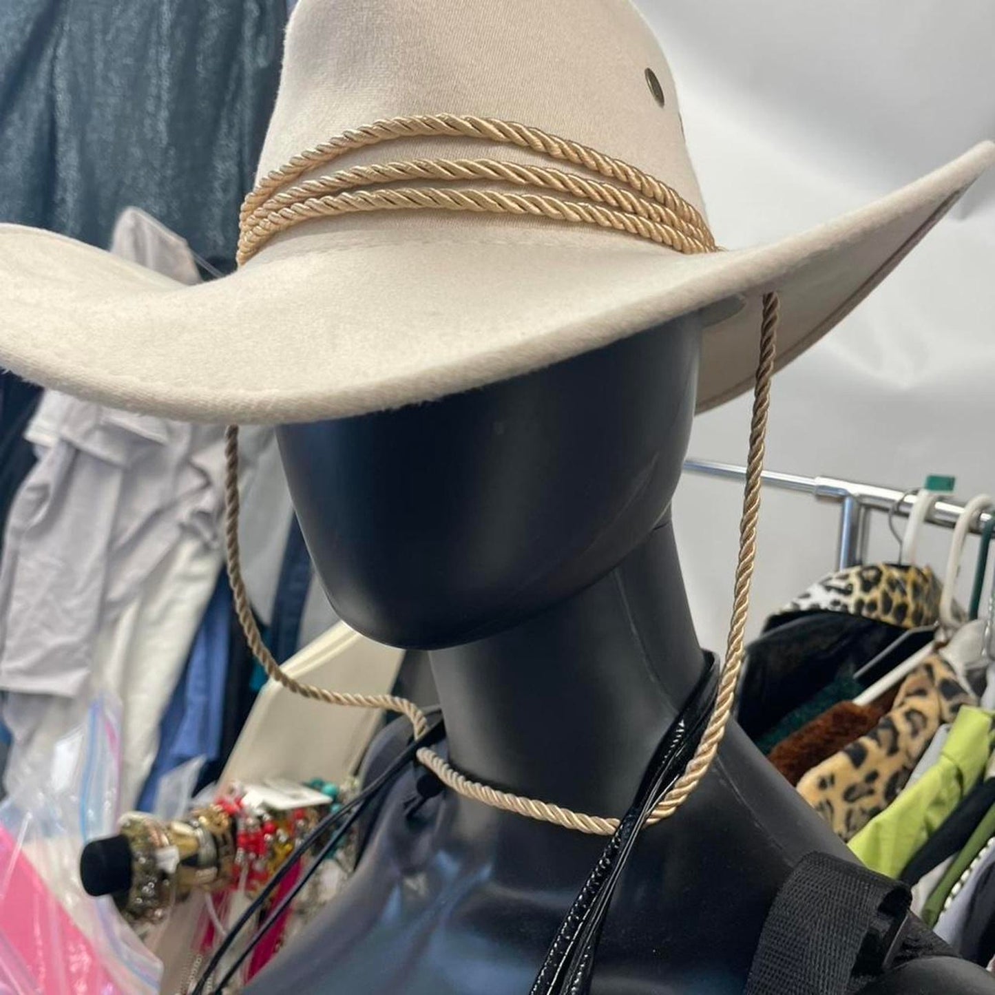 Tan cowboy hat with rope