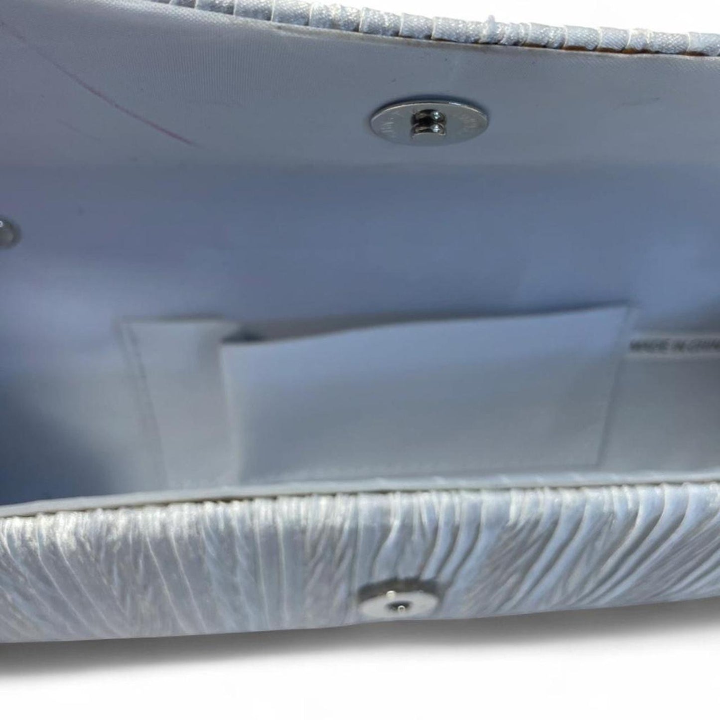 Silver clutch with rhinestone butterfly