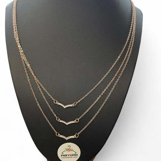 Layered gold necklace with diamond