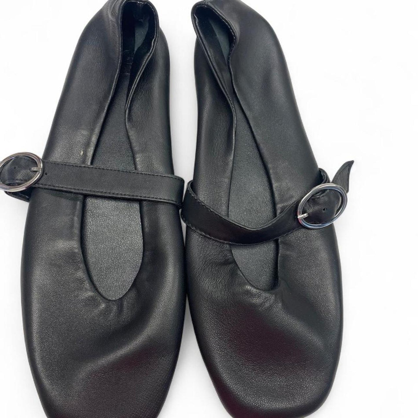 Black leather ballet flats