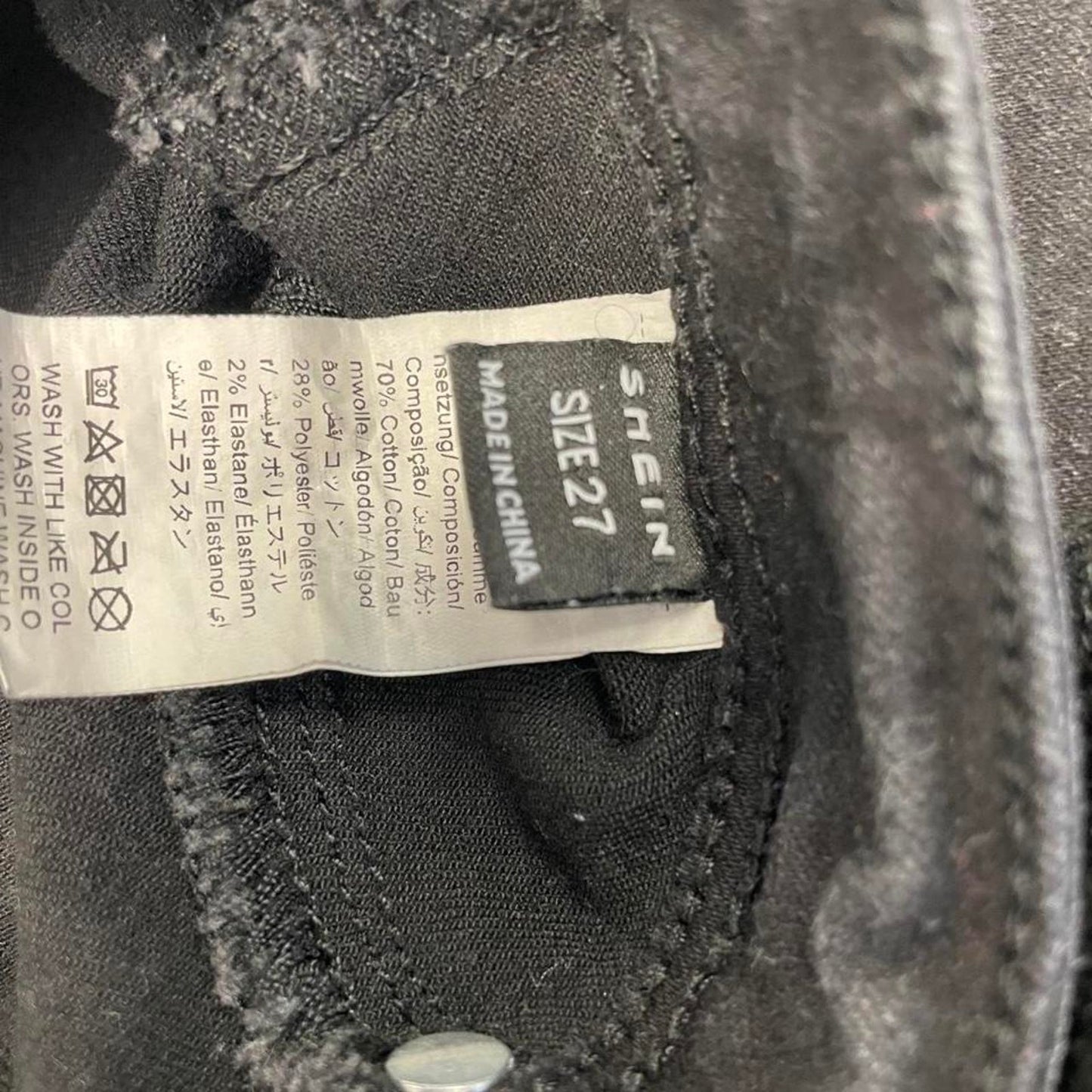 Black denim shorts with a