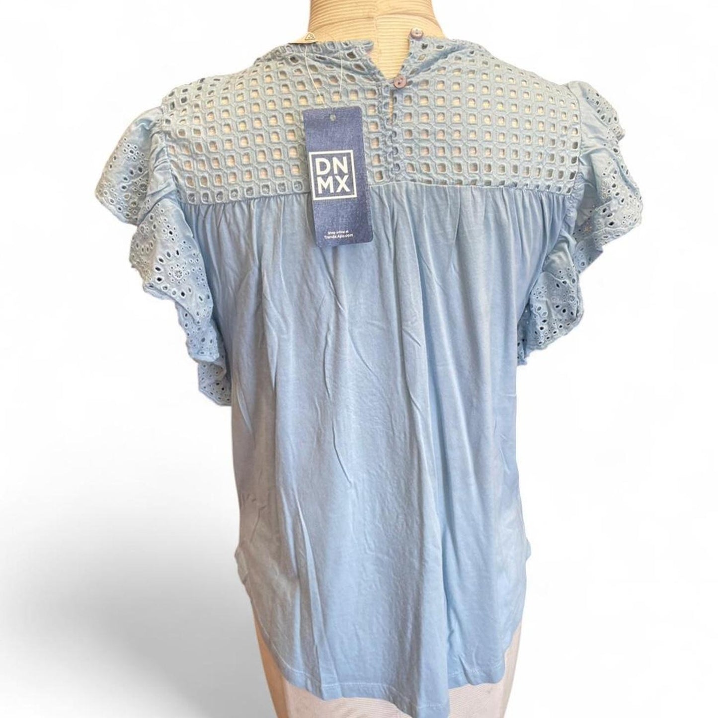 Light blue eyelet blouse with