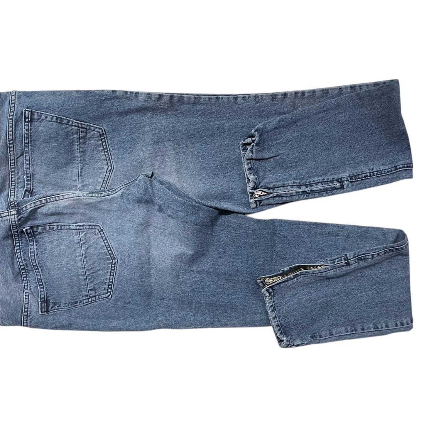 Distressed blue denim jeans