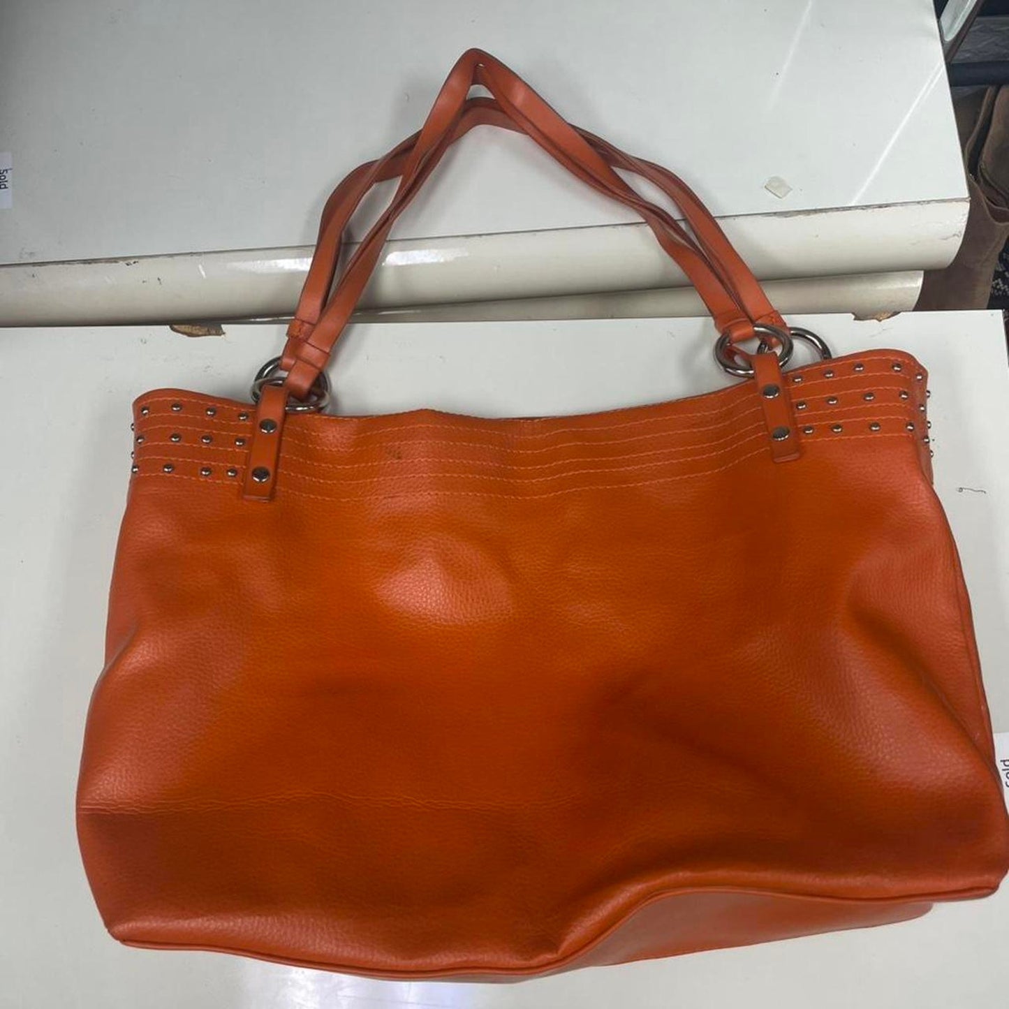 Orange leather tote bag with