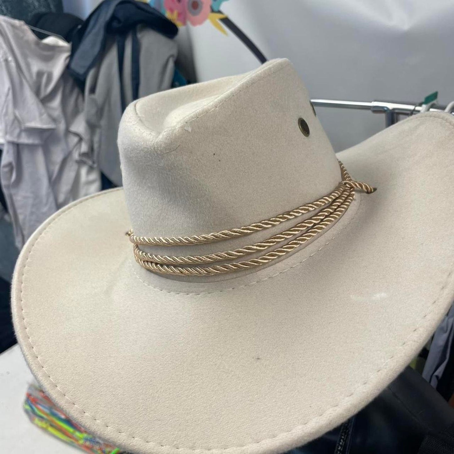 Tan cowboy hat with rope