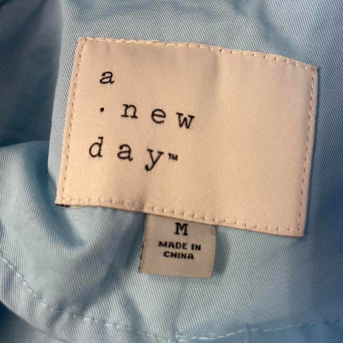 A new day light blue trench