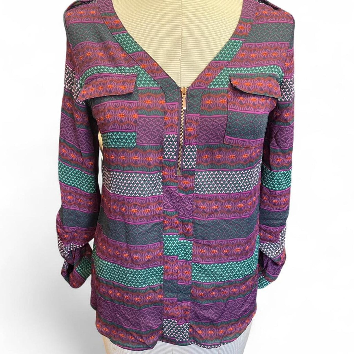 Purple and green patterned blouse