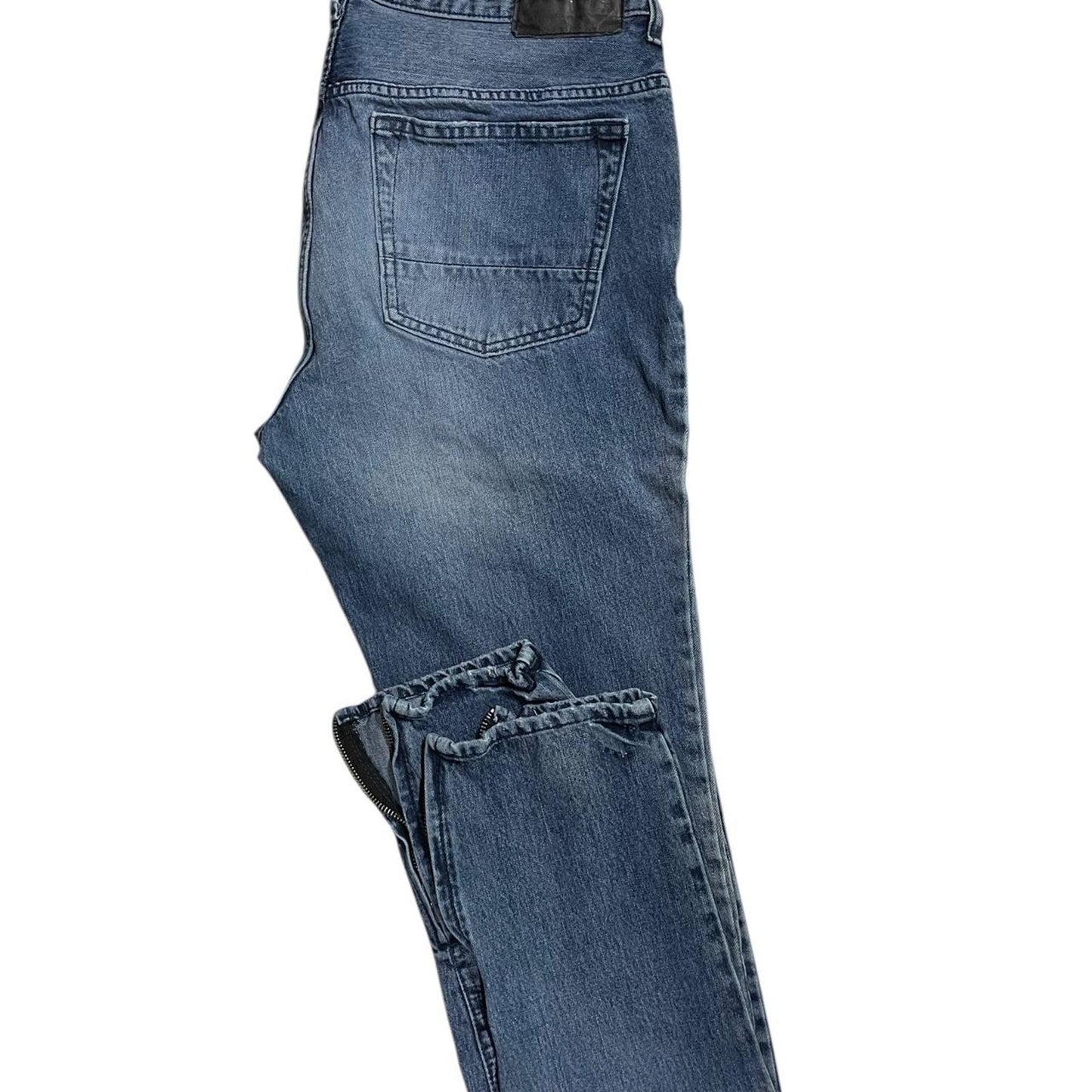 Distressed blue denim jeans