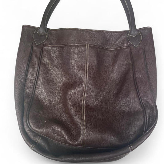 Brown leather handbag with leopard inside
