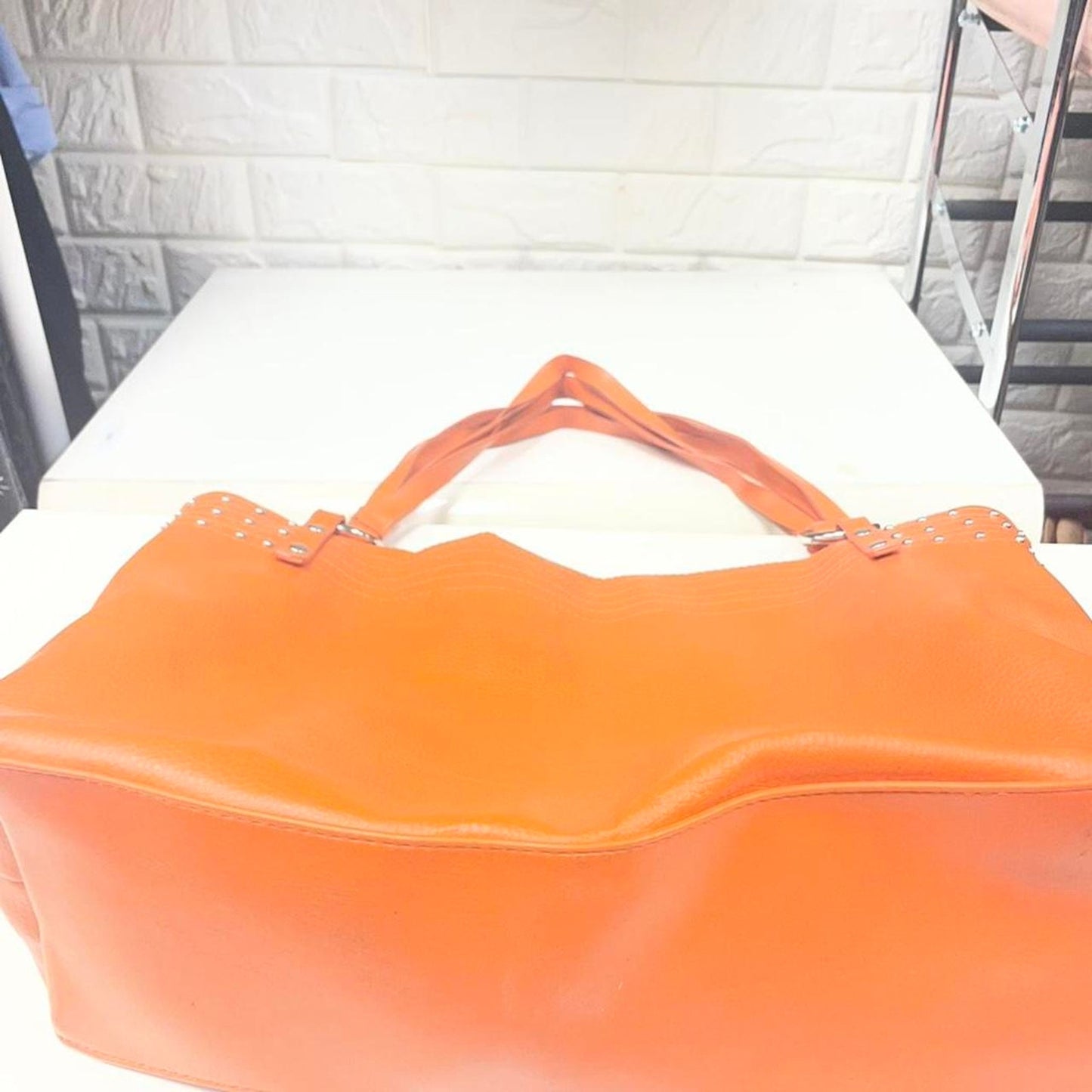 Orange leather tote bag with