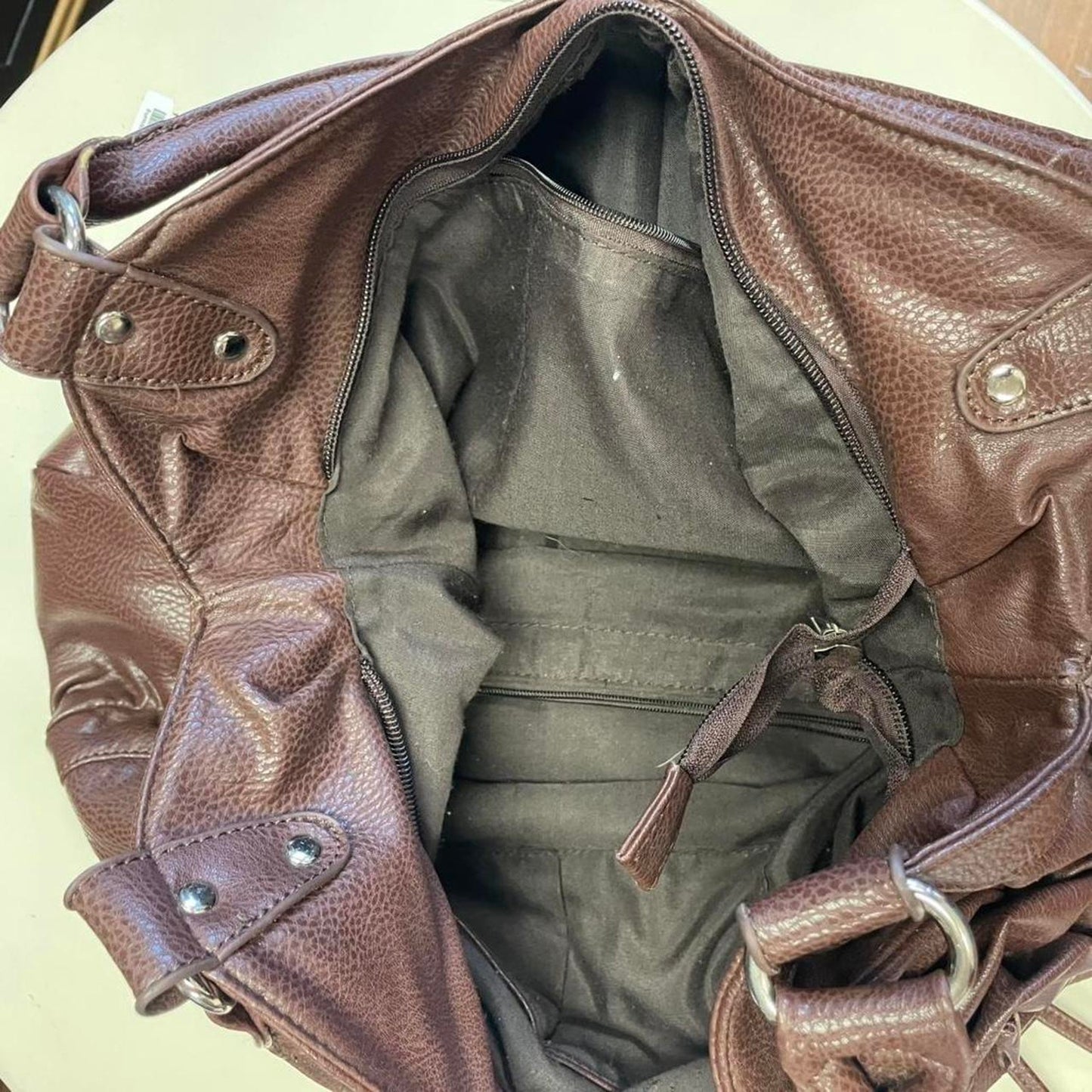 Brown leather handbag with flower