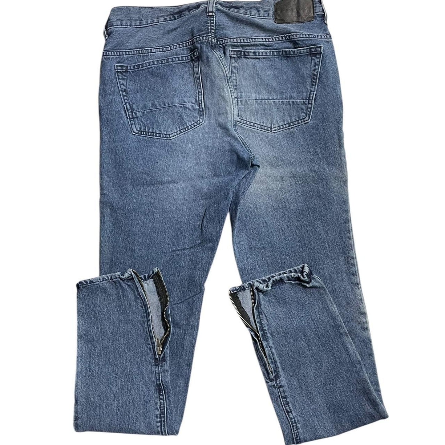 Distressed blue denim jeans