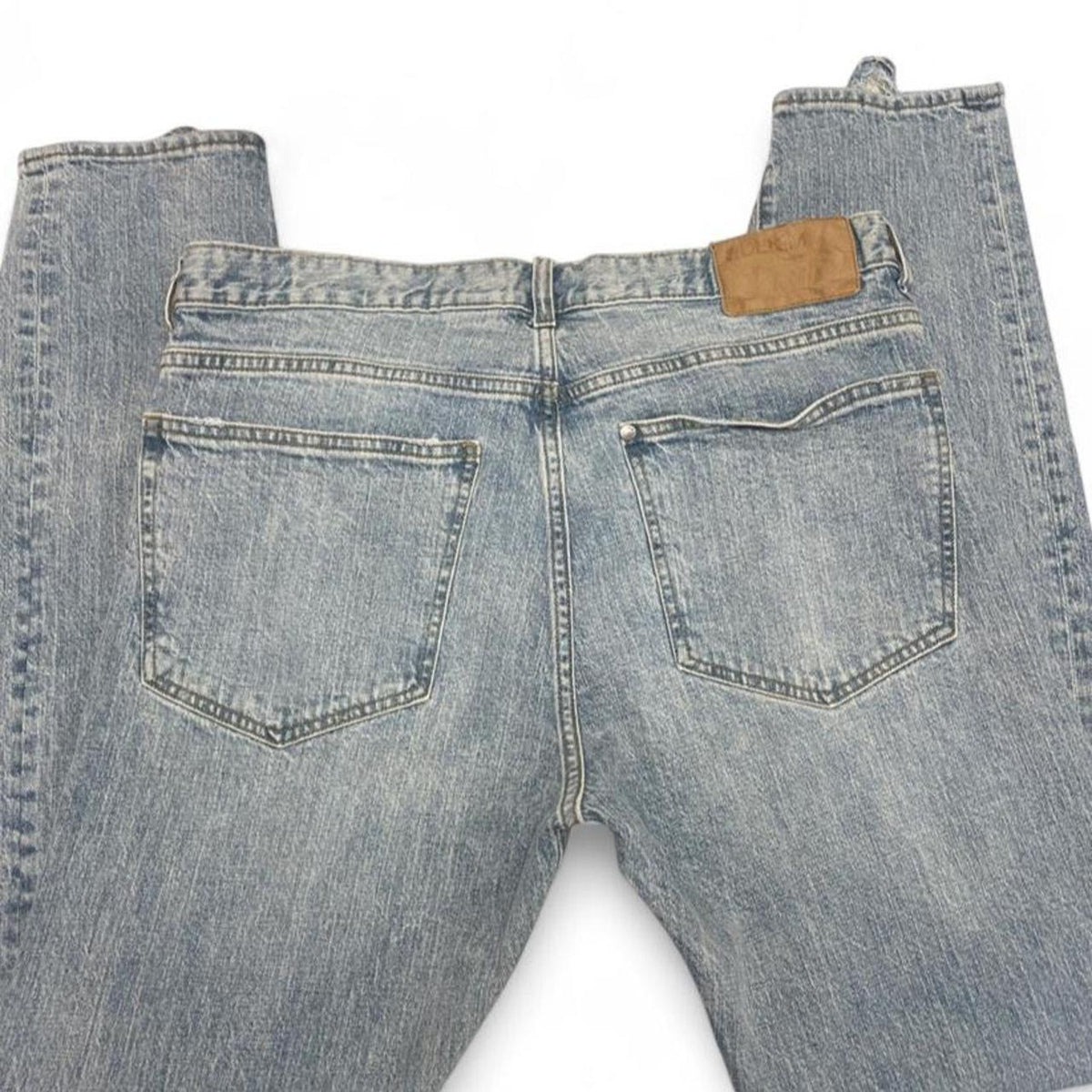 Light wash distressed denim jeans