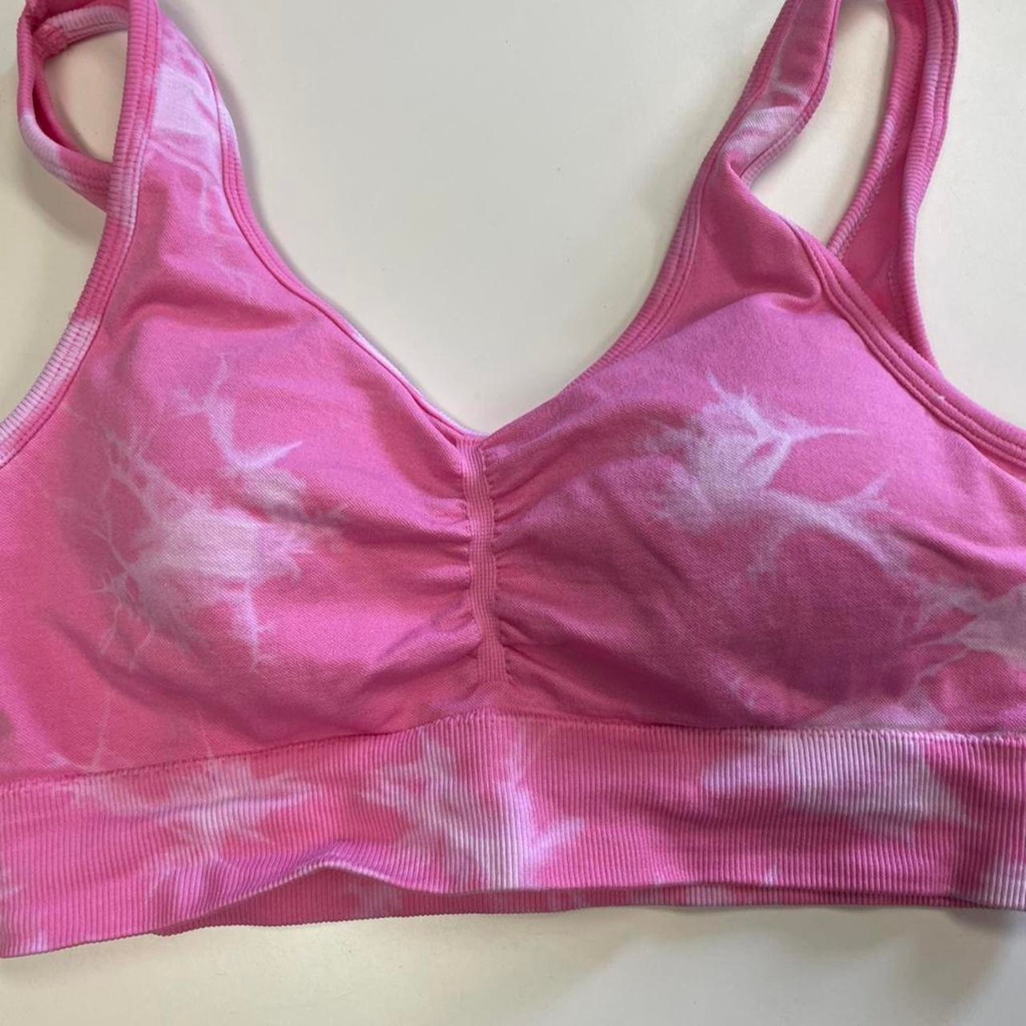 Pink tie dye sports bra and
