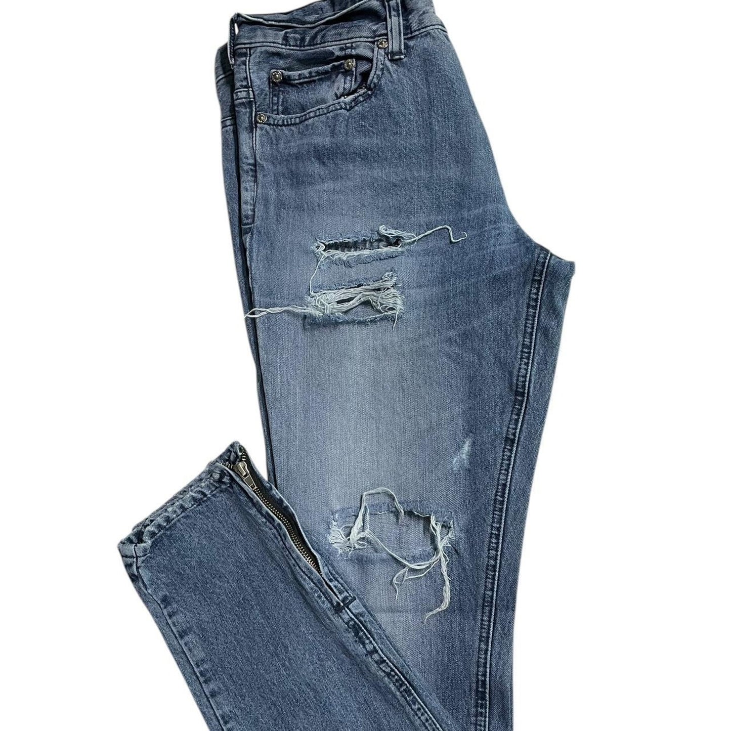 Distressed blue denim jeans