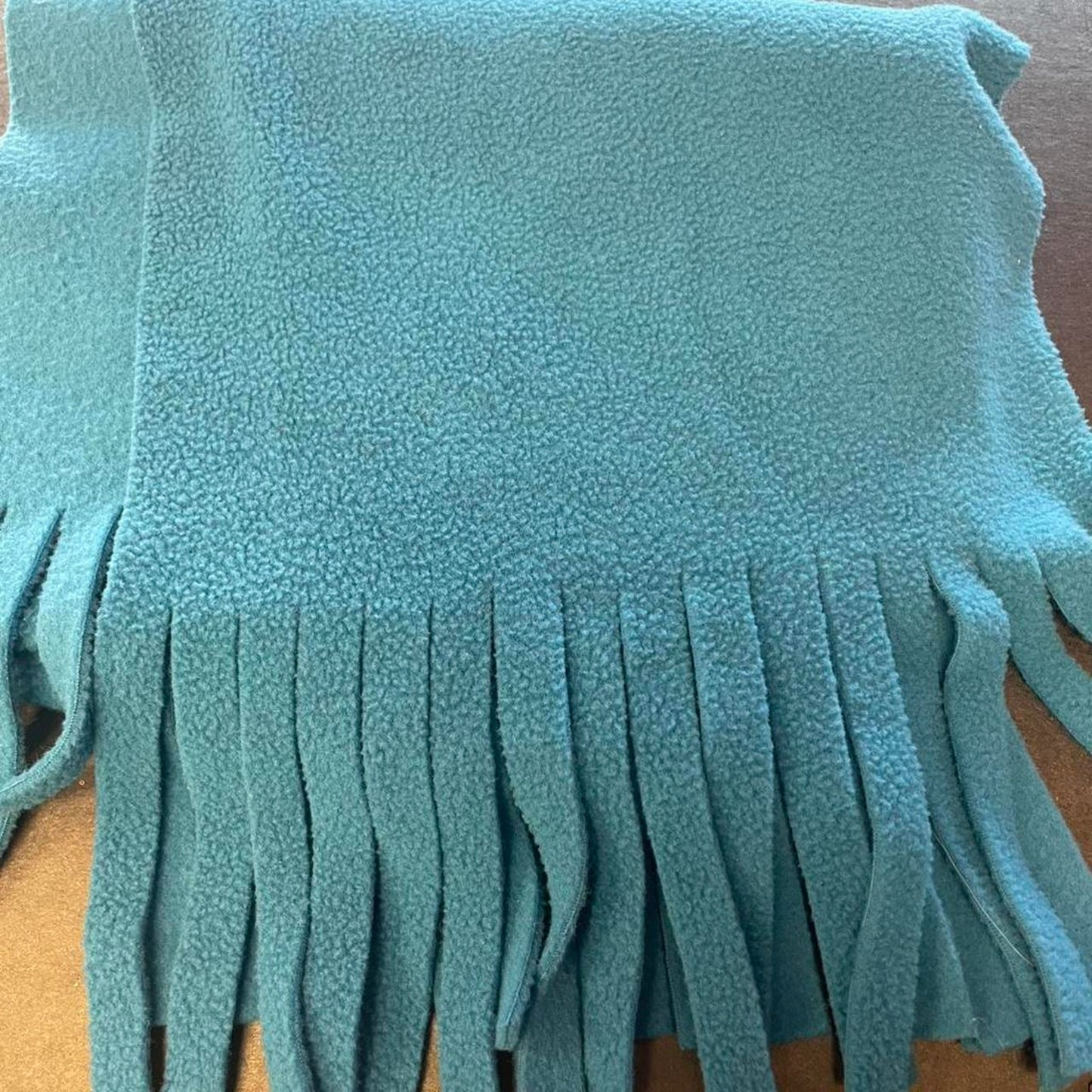 Blue fleece scarf with fringe
