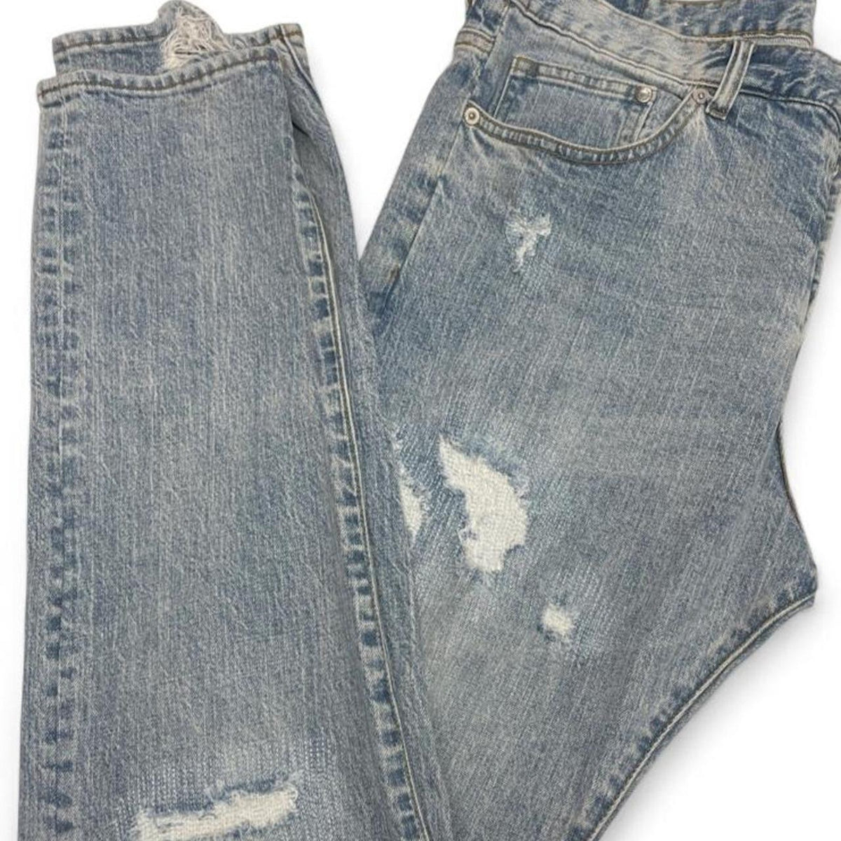 Light wash distressed denim jeans