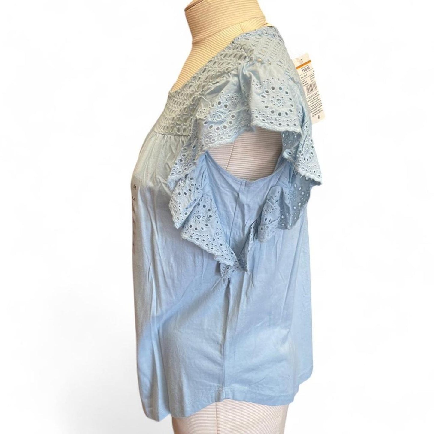 Light blue eyelet blouse with